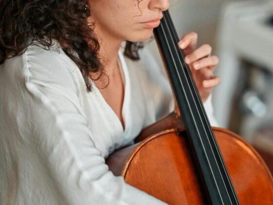 Woman learning how to play instrument during adult music lessons in Northern Virginia