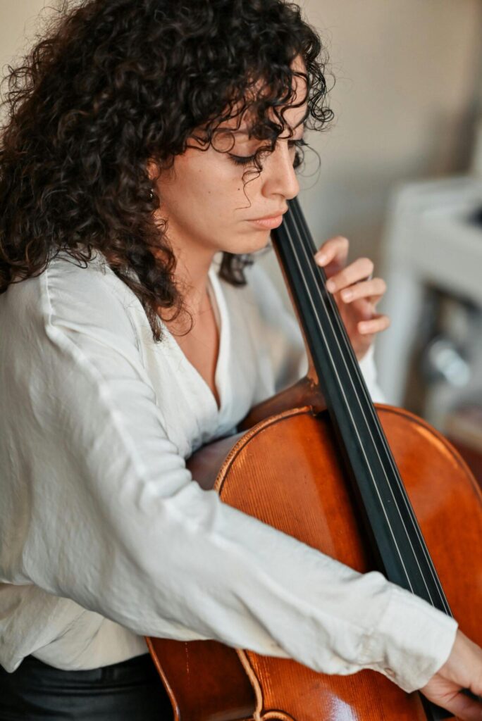 Woman learning how to play instrument during adult music lessons in Northern Virginia